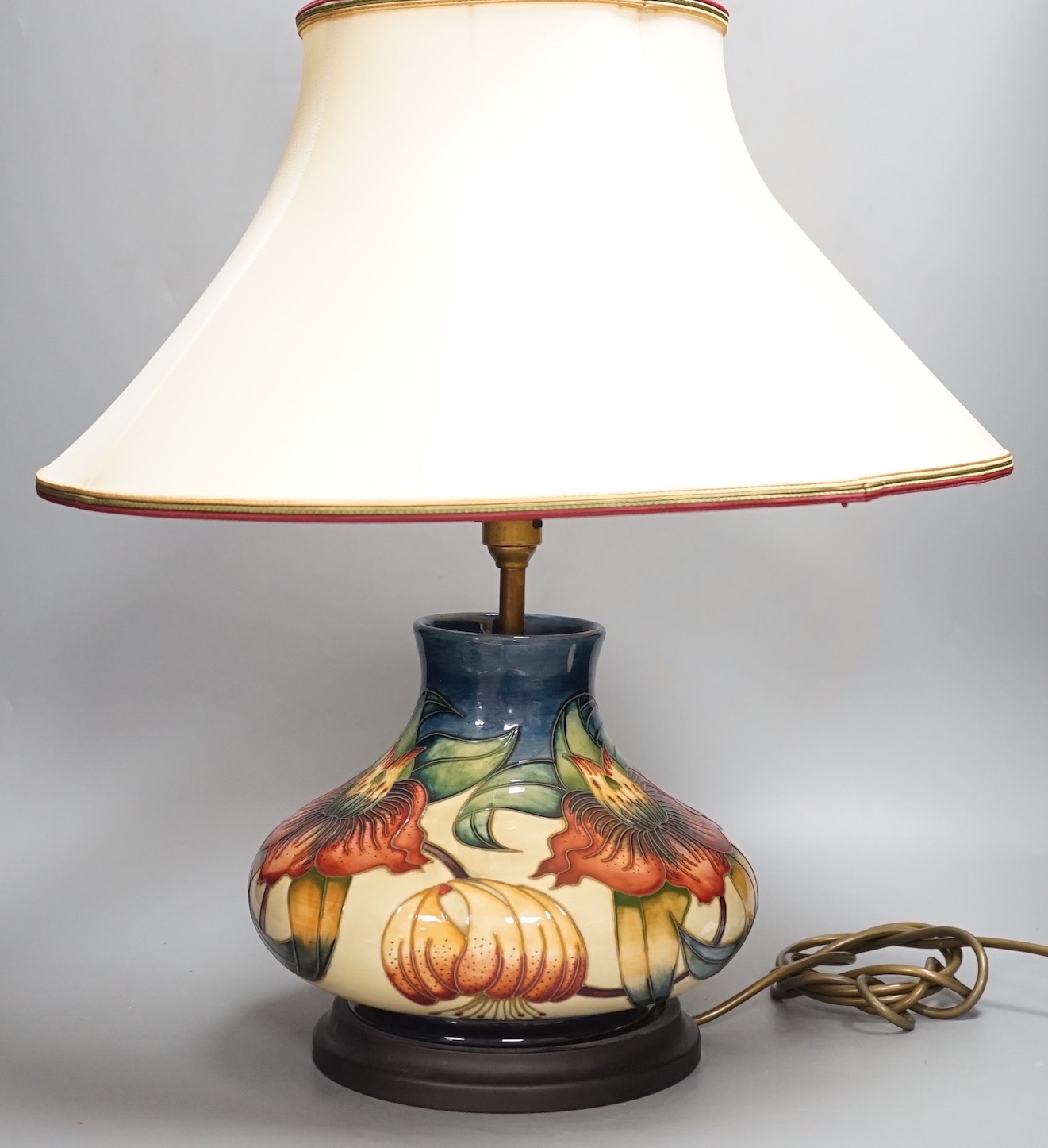 A Moorcroft Anna Lily pattern lamp base with shade